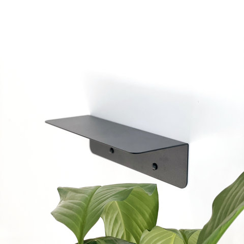 a black steel shelf in a modern bathroom design in Johannesburg or a modern black bathroom shelf