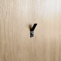 a black wall hook or towel hook in a ctm store in Johannesburg